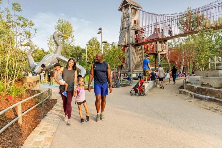 Families walking through Gathering Place park in Tulsa